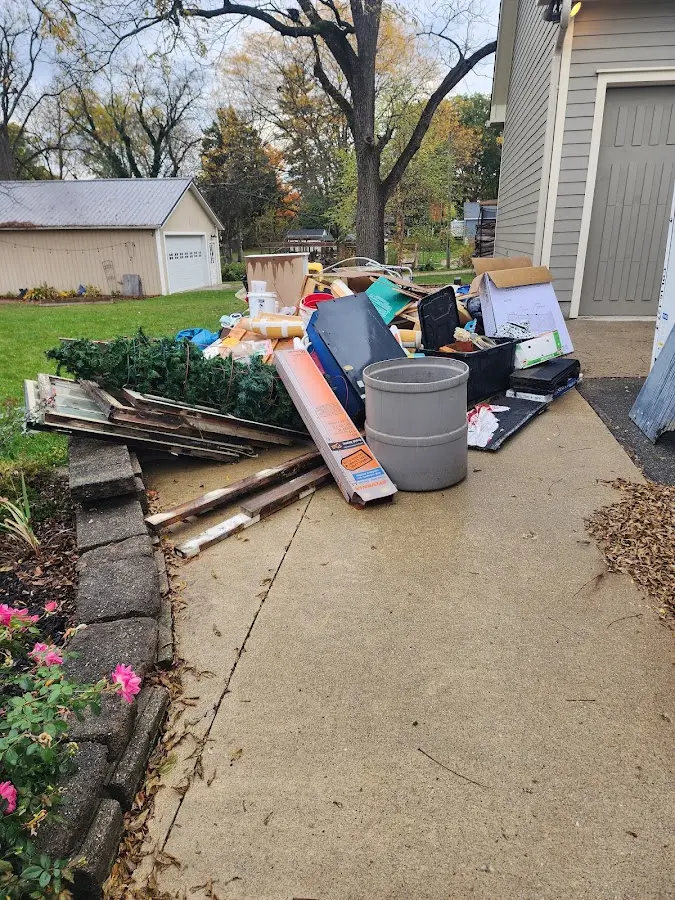 Dumpster being loaded with debris for 3 Yard Dumpster Rental in Evanston
